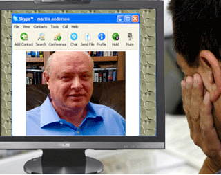 Val&eacute;ry Fradkov works with a client 
						via video conferencing